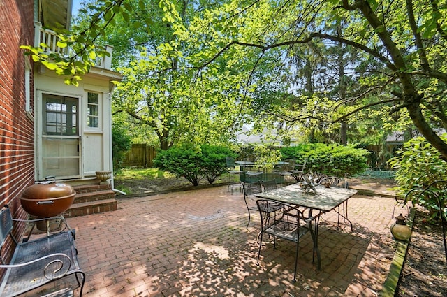 1875 King Ave, Columbus, OH 43212 - fenced backyard featuring outdoor dining area, entry steps, and a patio area