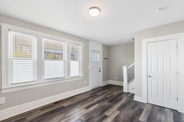 638 Stewart Ave, Columbus, OH 43206 - entrance foyer featuring dark wood-type flooring, baseboards, and stairway