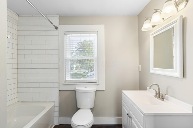 638 Stewart Ave, Columbus, OH 43206 - bathroom with plenty of natural light, toilet, vanity, and baseboards