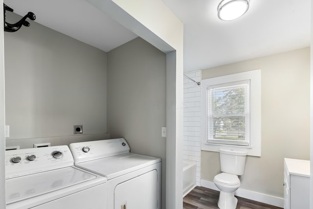 638 Stewart Ave, Columbus, OH 43206 - washroom with washing machine and dryer, dark wood-style floors, and baseboards