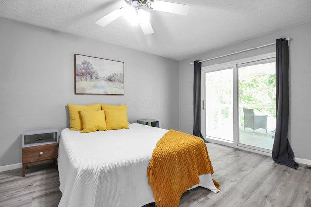 232 Camrose Ct, Columbus, OH 43230 - bedroom featuring access to outside, light wood-style flooring, baseboards, a ceiling fan, and a textured ceiling