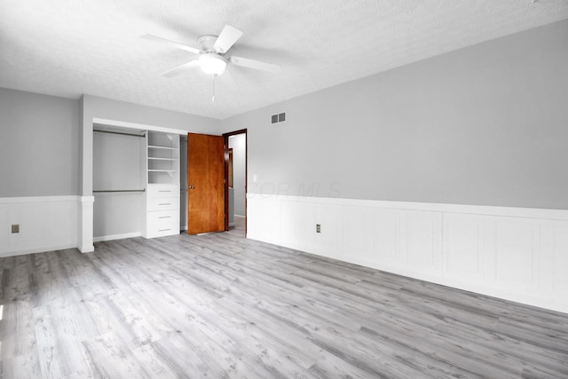 232 Camrose Ct, Columbus, OH 43230 - unfurnished bedroom with wood finished floors, a textured ceiling, a closet, and ceiling fan