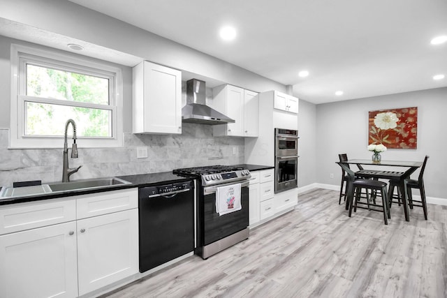 232 Camrose Ct, Columbus, OH 43230 - kitchen featuring wall chimney range hood, appliances with stainless steel finishes, a sink, dark countertops, and recessed lighting