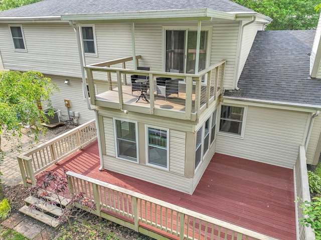 232 Camrose Ct, Columbus, OH 43230 - back of house featuring a shingled roof, a wooden deck, and cooling unit