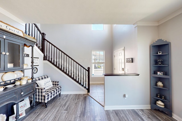 2096 English Turn Dr, Grove City, OH 43123 - entrance foyer featuring wood finished floors, stairs, baseboards, and crown molding