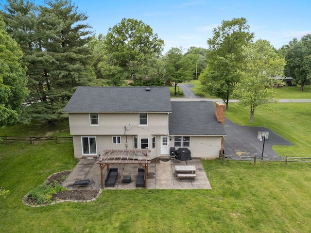 13682 Cobblestone Ln, Pickerington, OH 43147 - back of property with a patio, a chimney, and a shingled roof