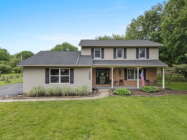 13682 Cobblestone Ln, Pickerington, OH 43147 - traditional home with a porch, brick siding, and a shingled roof