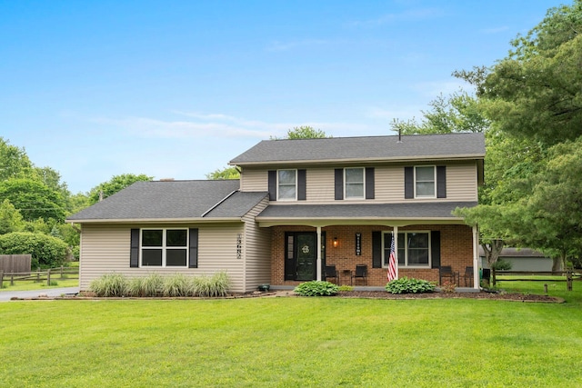 13682 Cobblestone Ln, Pickerington, OH 43147 - traditional-style house with covered porch and brick siding