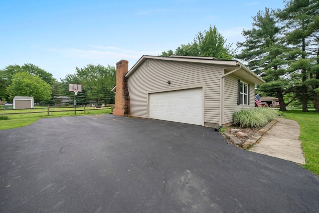 13682 Cobblestone Ln, Pickerington, OH 43147 - view of side of property featuring asphalt driveway and an outdoor structure