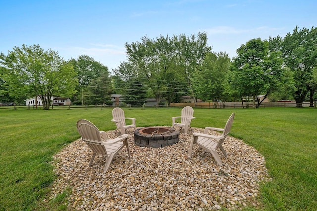 13682 Cobblestone Ln, Pickerington, OH 43147 - view of yard with a fire pit and view of wooded area