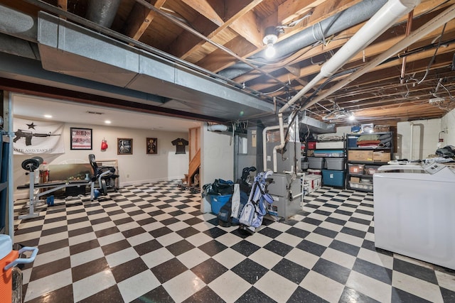13682 Cobblestone Ln, Pickerington, OH 43147 - below grade area with tile patterned floors, washing machine and dryer, heating unit, and baseboards