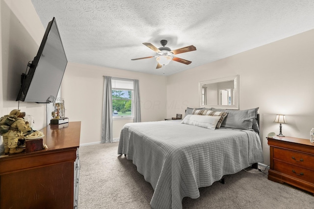 13682 Cobblestone Ln, Pickerington, OH 43147 - bedroom featuring carpet flooring, baseboards, a textured ceiling, and ceiling fan