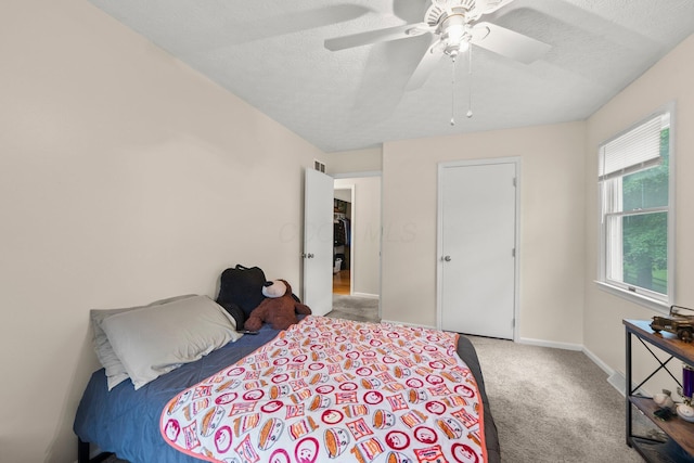 13682 Cobblestone Ln, Pickerington, OH 43147 - bedroom featuring carpet, a textured ceiling, ceiling fan, and baseboards