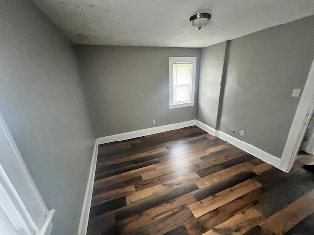 1403 Genessee Ave, Columbus, OH 43211 - empty room with dark wood-type flooring and baseboards