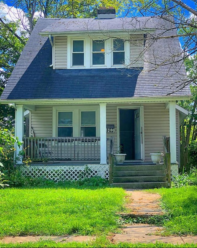 1403 Genessee Ave, Columbus, OH 43211 - view of front facade featuring a porch and a chimney