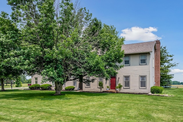 3902 Maple Grove Rd, Marion, OH 43302 - view of front of home with a chimney, a front yard, and roof with shingles