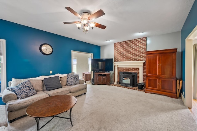 3902 Maple Grove Rd, Marion, OH 43302 - living room with a ceiling fan, a wood stove, and radiator heating unit