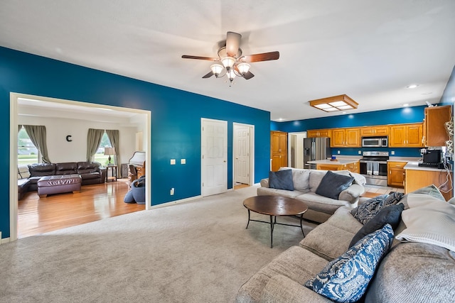 3902 Maple Grove Rd, Marion, OH 43302 - living area featuring light colored carpet, ceiling fan, baseboards, and recessed lighting