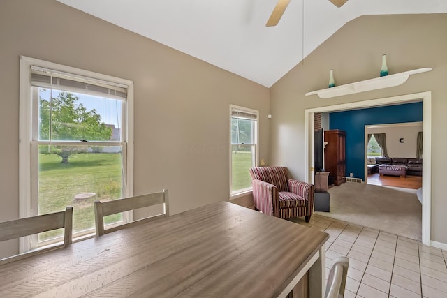 3902 Maple Grove Rd, Marion, OH 43302 - dining space with ceiling fan, healthy amount of natural light, light carpet, light tile patterned floors, and high vaulted ceiling