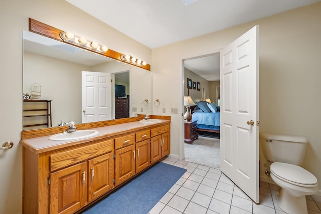 3902 Maple Grove Rd, Marion, OH 43302 - full bath with double vanity, tile patterned floors, connected bathroom, and toilet