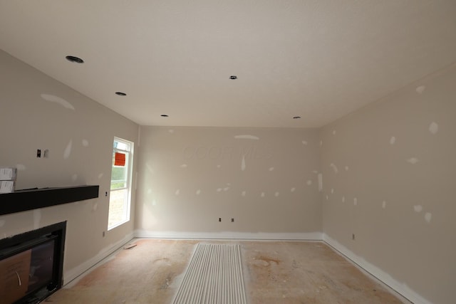979 Heimat Haus Dr, Grove City, OH 43123 - unfurnished living room with baseboards and a glass covered fireplace