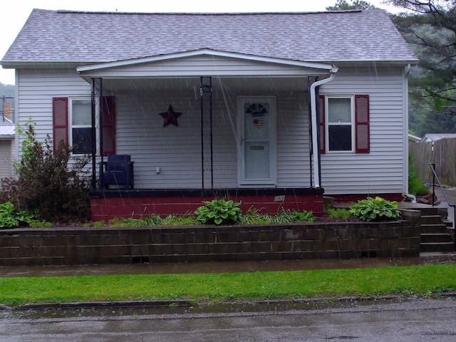 760 Poplar St, Nelsonville, OH 45764 - view of front of property with covered porch and roof with shingles