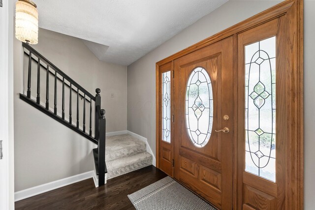 3567 Rochfort Bridge Dr, Columbus, OH 43221 - foyer entrance featuring stairs, baseboards, and dark wood-style floors