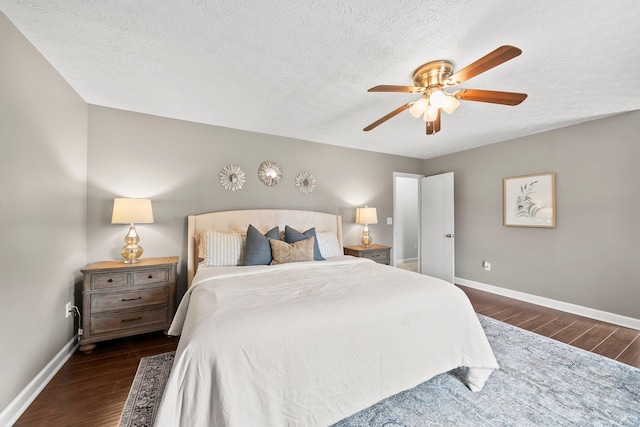3567 Rochfort Bridge Dr, Columbus, OH 43221 - bedroom with dark wood-style floors, baseboards, ceiling fan, and a textured ceiling