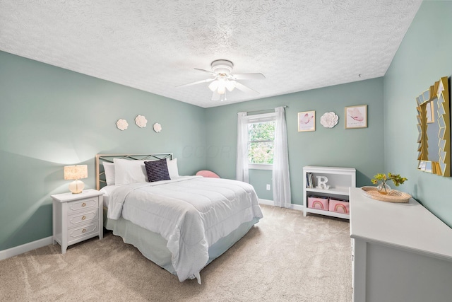 3567 Rochfort Bridge Dr, Columbus, OH 43221 - bedroom with light colored carpet, baseboards, a ceiling fan, and a textured ceiling