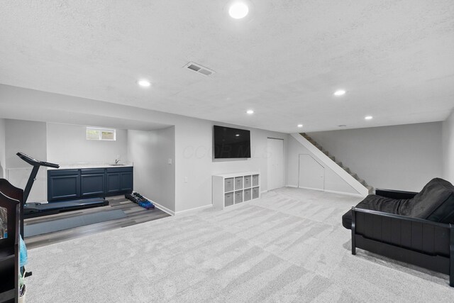 3567 Rochfort Bridge Dr, Columbus, OH 43221 - sitting room featuring baseboards, light colored carpet, stairs, recessed lighting, and a textured ceiling