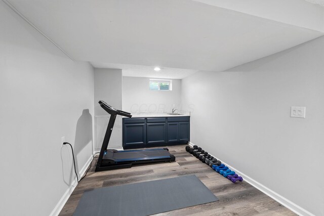 3567 Rochfort Bridge Dr, Columbus, OH 43221 - workout area with wood finished floors and baseboards