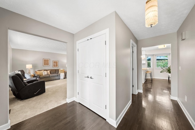 3567 Rochfort Bridge Dr, Columbus, OH 43221 - corridor with dark wood-style flooring and baseboards