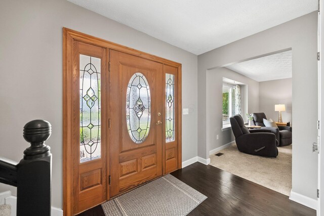 3567 Rochfort Bridge Dr, Columbus, OH 43221 - entryway featuring baseboards and dark wood-type flooring