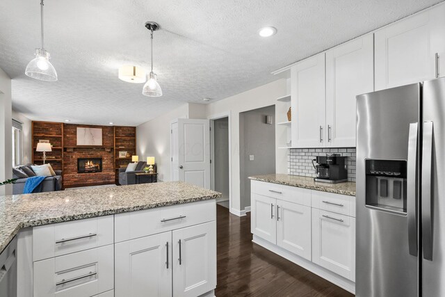 3567 Rochfort Bridge Dr, Columbus, OH 43221 - kitchen featuring stainless steel refrigerator with ice dispenser, a textured ceiling, open shelves, open floor plan, and tasteful backsplash