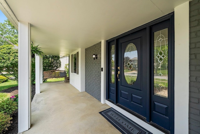 3567 Rochfort Bridge Dr, Columbus, OH 43221 - view of exterior entry featuring covered porch and brick siding