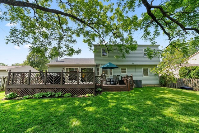 3567 Rochfort Bridge Dr, Columbus, OH 43221 - rear view of house with central AC unit, a wooden deck, and a chimney