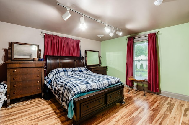 7050 Motts Place Rd, Canal Winchester, OH 43110 - bedroom with rail lighting and light wood-style flooring