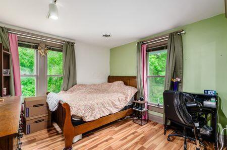 7050 Motts Place Rd, Canal Winchester, OH 43110 - bedroom with multiple windows and light wood-style floors