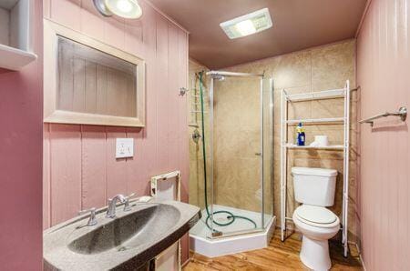 7050 Motts Place Rd, Canal Winchester, OH 43110 - full bath featuring toilet, a stall shower, wood finished floors, and vanity