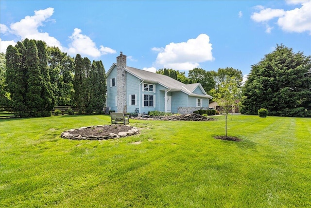 1205 Holton Rd, Grove City, OH 43123 - view of front of property featuring a chimney and a front lawn