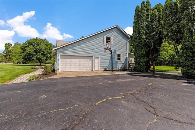 1205 Holton Rd, Grove City, OH 43123 - view of property exterior featuring driveway and an attached garage