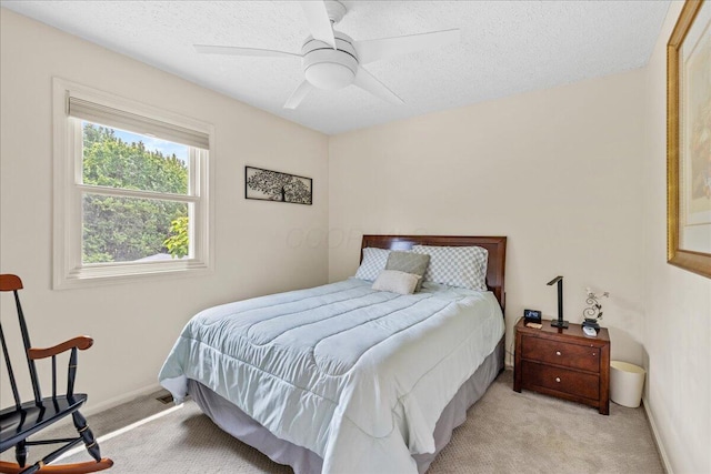 1205 Holton Rd, Grove City, OH 43123 - bedroom featuring light carpet, a textured ceiling, a ceiling fan, and baseboards