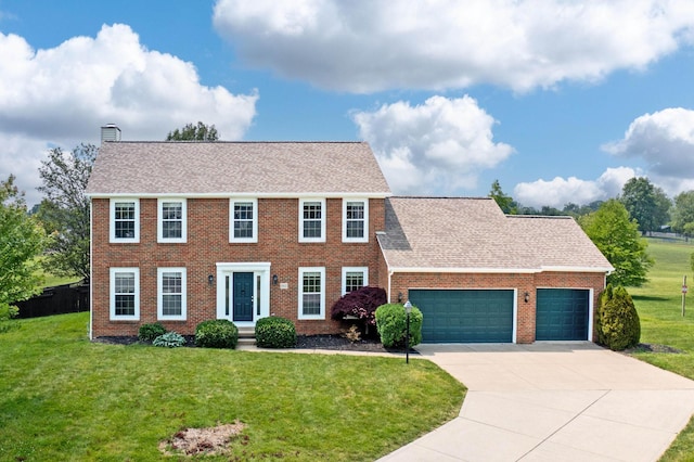 9302 Pimlico Pl, Pickerington, OH 43147 - colonial-style house with brick siding, an attached garage, driveway, a chimney, and a front yard