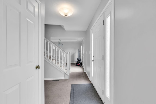9302 Pimlico Pl, Pickerington, OH 43147 - foyer entrance featuring tile patterned flooring, stairs, and baseboards