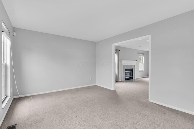 9302 Pimlico Pl, Pickerington, OH 43147 - unfurnished room featuring carpet flooring, baseboards, and a tiled fireplace