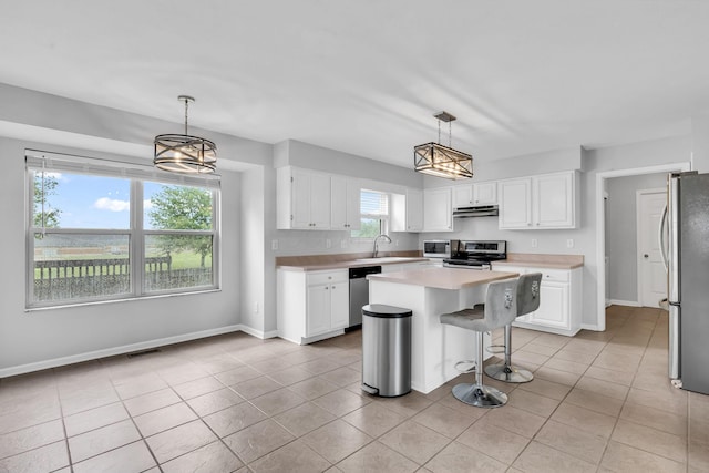 9302 Pimlico Pl, Pickerington, OH 43147 - kitchen with appliances with stainless steel finishes, baseboards, white cabinetry, and light countertops
