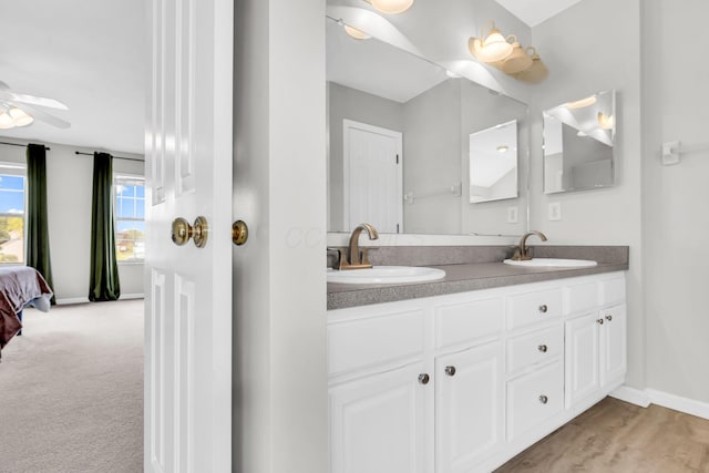 9302 Pimlico Pl, Pickerington, OH 43147 - full bathroom featuring double vanity, baseboards, ensuite bath, and ceiling fan