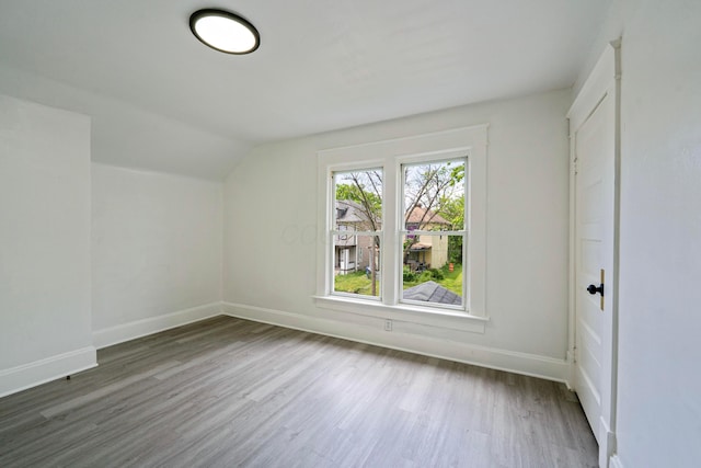 452 N Ohio Ave, Columbus, OH 43203 - additional living space with wood finished floors, baseboards, and vaulted ceiling
