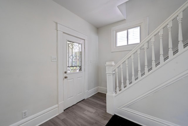 452 N Ohio Ave, Columbus, OH 43203 - entryway featuring wood finished floors, baseboards, and stairs
