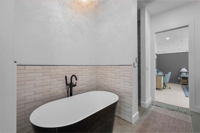 3226 Bean Oller Rd, Delaware, OH 43015 - ensuite bathroom with a soaking tub and a wainscoted wall